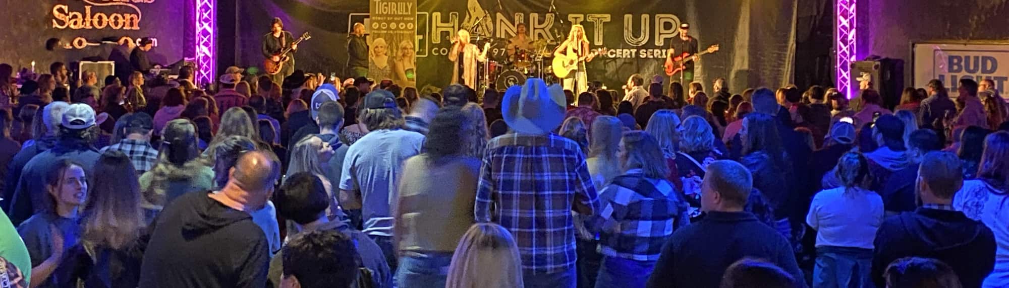 country concert with fans wearing cowboy hats Daytona Beach
