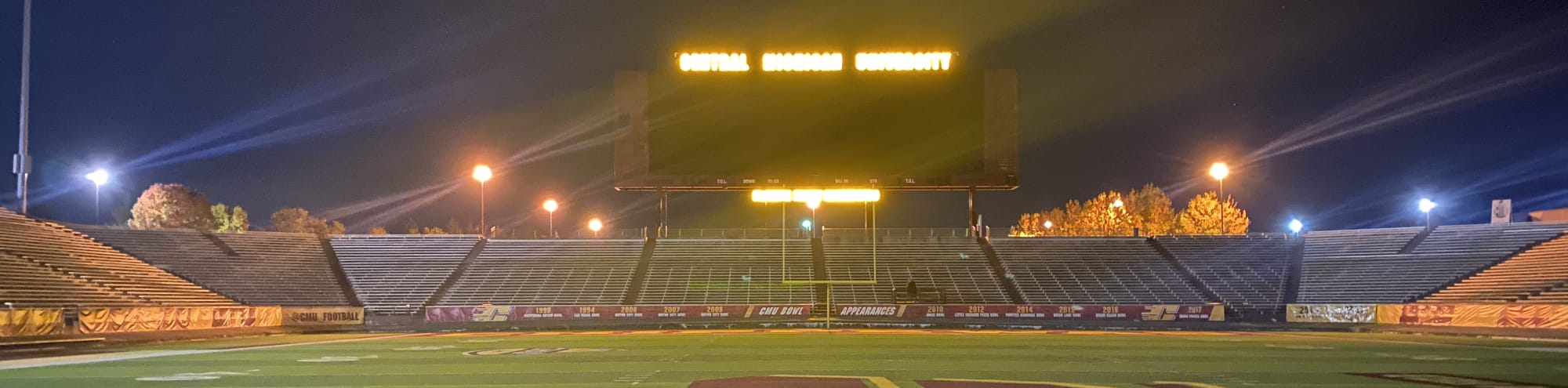 empty football stadium at night under the lights Daytona Beach